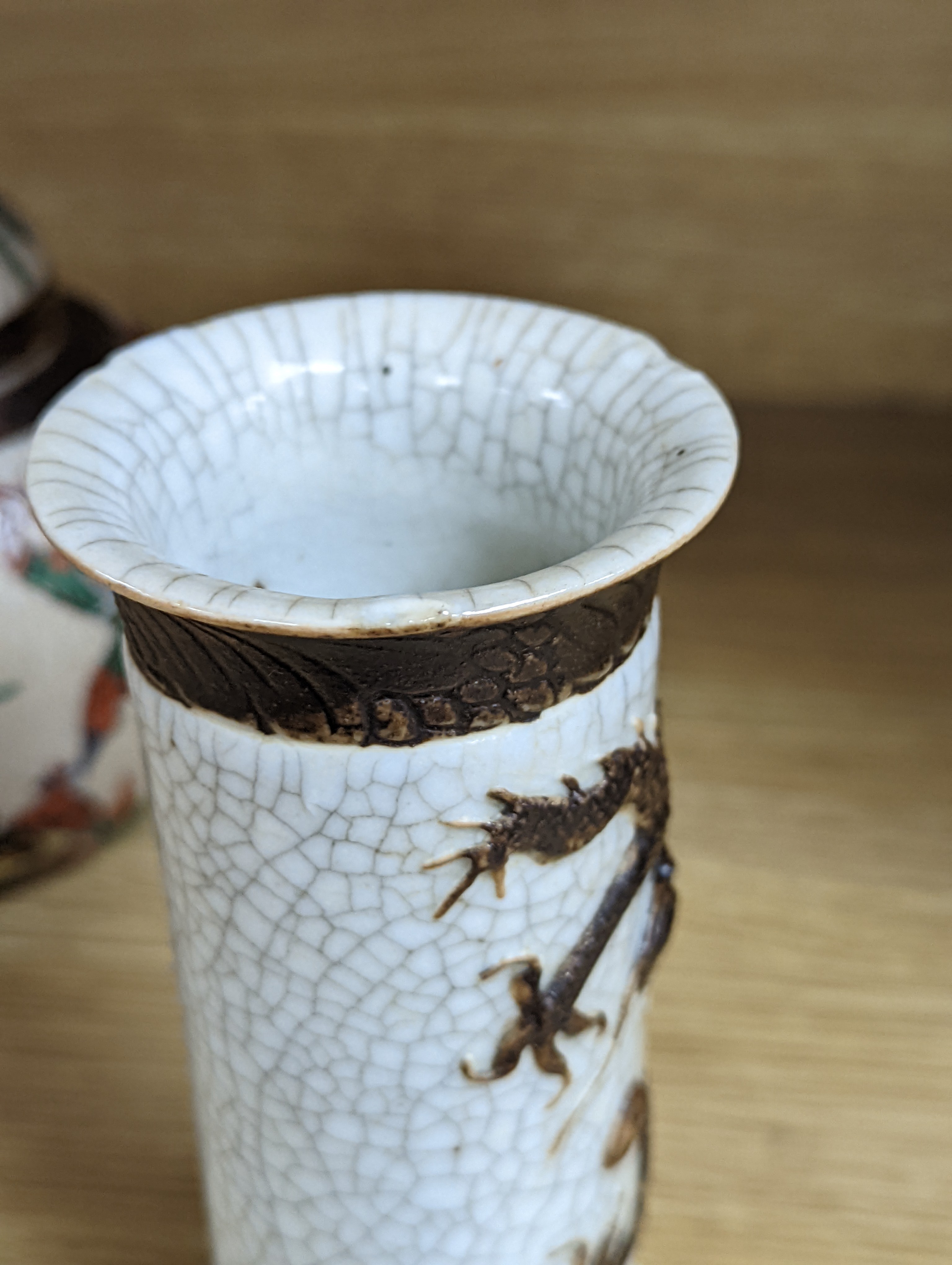 A Chinese famille verte crackle glaze jar and cover, 14.5cm, two famille rose dishes and a crackle glaze ‘dragon’ vase, all late 19th/early 20th century